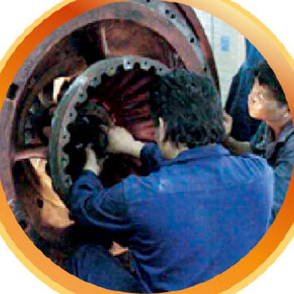 Technicians working inside a large machine